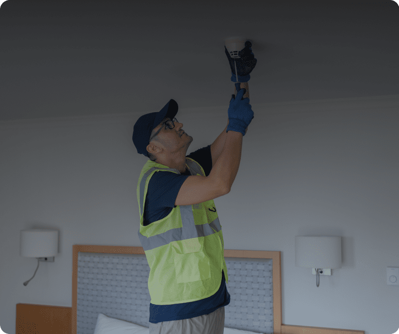 Man in safety vest working indoors