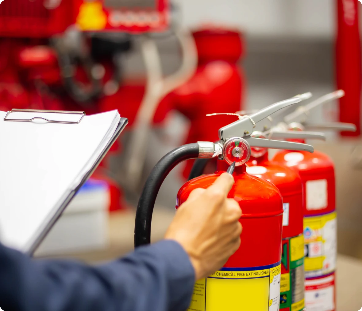 Checking fire extinguisher pressure gauge